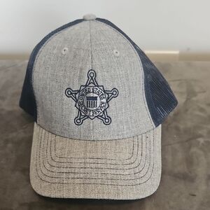 Men's Grey and Navy Trucker Hat with Embroidered Badge